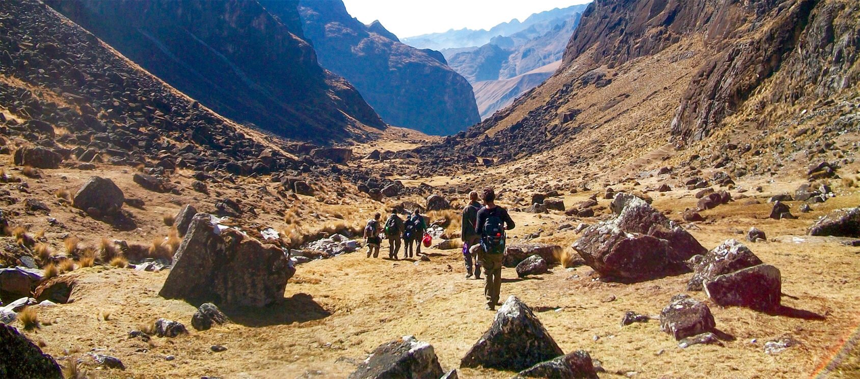 group trekking in Bolivian mountains