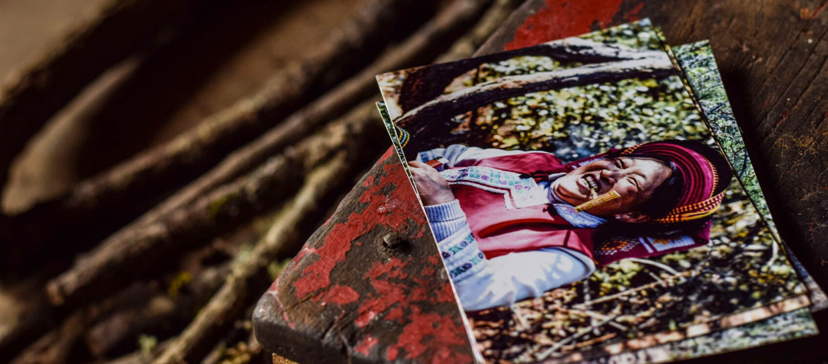 photographs lying on red bench